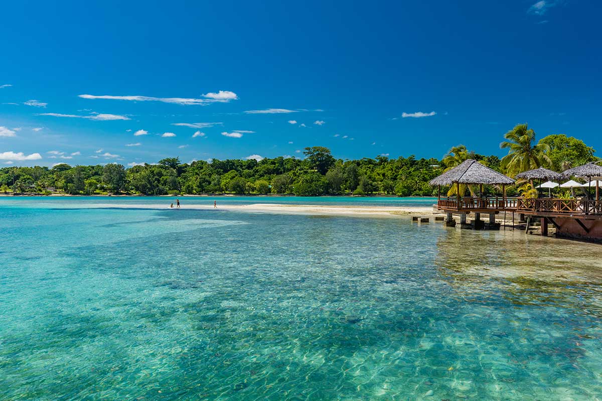 Vanuatu holidays from Australia — an active volcano above lush rainforest