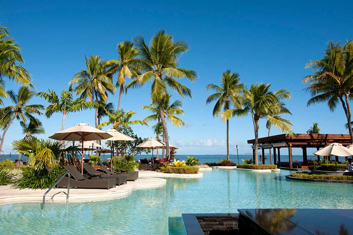 Fiji family holiday — children swimming at island resort